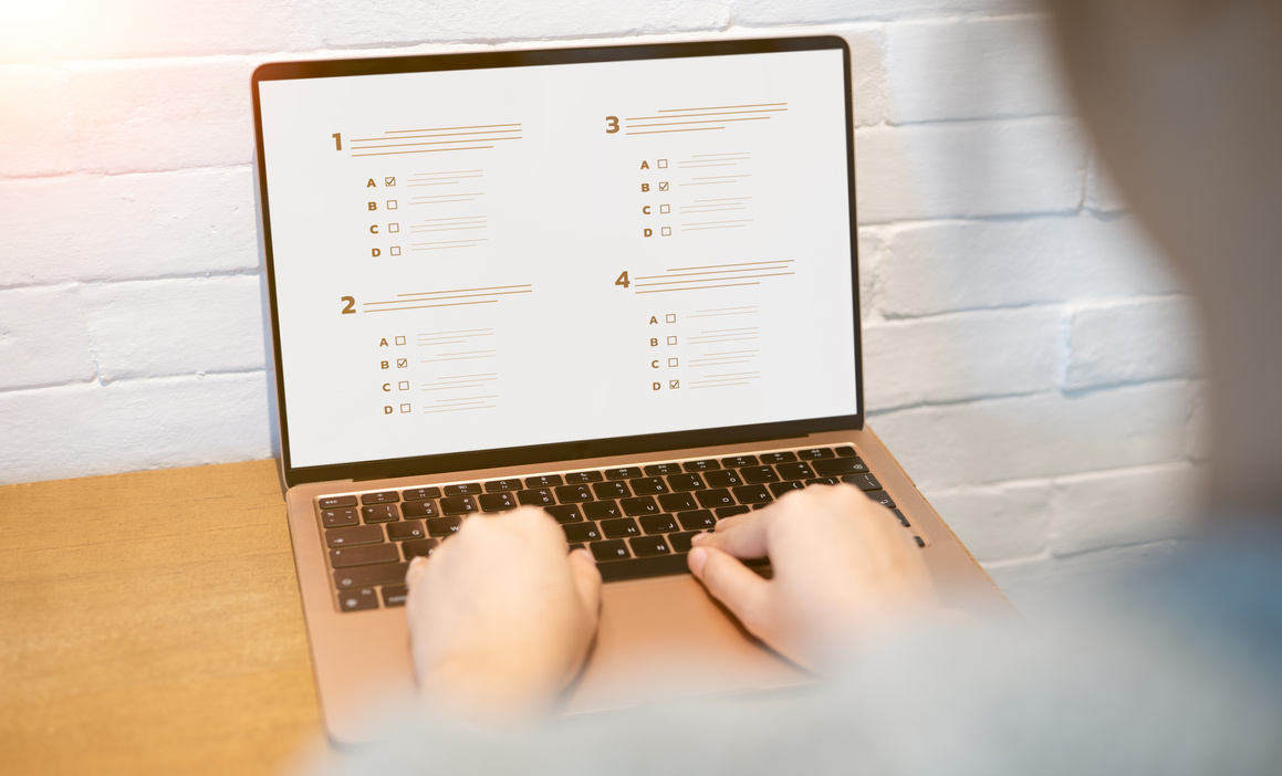 Woman passing online exam, Questionnaire online with checkboxes, Evaluation, Online survey online exam Choosing the right answer in the exam, Test questions. Filling out online survey form business.